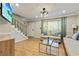 Cozy living room with hardwood floors, comfortable seating, a TV, and stairway access at 1600 Briarcliff Ne Rd # 5, Atlanta, GA 30306