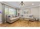 Inviting living room featuring hardwood floors, light-colored sofas, and a view of the window at 1600 Briarcliff Ne Rd # 5, Atlanta, GA 30306