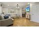Bright living room with hardwood floors, neutral decor, modern lighting, and comfortable seating at 1600 Briarcliff Ne Rd # 5, Atlanta, GA 30306