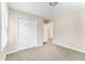 This bedroom offers neutral walls, a closet, carpet, and a window to let in natural light at 3169 Bluebird Ln, Decatur, GA 30032