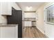 Well-lit kitchen featuring stainless steel appliances, granite countertops, and white cabinetry at 3169 Bluebird Ln, Decatur, GA 30032