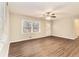 Bright living room featuring modern flooring, a ceiling fan, and natural light at 3169 Bluebird Ln, Decatur, GA 30032