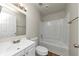 Well-lit bathroom with a shower-tub combo, white cabinets, and modern fixtures at 4481 Buckingham Cir, Decatur, GA 30035