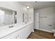 Bright bathroom featuring a dual sink vanity and a shower-tub combo at 4481 Buckingham Cir, Decatur, GA 30035