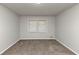 This bedroom features large windows and carpeted floors at 4481 Buckingham Cir, Decatur, GA 30035