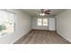 Bright bedroom with a ceiling fan, two windows, and neutral walls at 4481 Buckingham Cir, Decatur, GA 30035