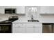 A modern kitchen with stainless steel appliances and white cabinetry at 4481 Buckingham Cir, Decatur, GA 30035