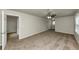 Spacious living room with ample natural light and neutral walls and carpet at 4481 Buckingham Cir, Decatur, GA 30035