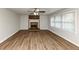Spacious living room with hardwood flooring, fireplace, and lots of natural light at 4481 Buckingham Cir, Decatur, GA 30035