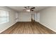 This room features hardwood floors, a ceiling fan, and abundant natural light at 4481 Buckingham Cir, Decatur, GA 30035
