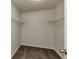 A walk-in closet with carpet and shelving for optimal storage at 4481 Buckingham Cir, Decatur, GA 30035