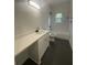 Bright bathroom featuring modern fixtures, white subway tile, and a contrasting dark floor at 937 Camilla Sw St, Atlanta, GA 30314