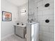 Sleek bathroom featuring a modern vanity, sink, and glass shower creating an upscale look at 937 Camilla Sw St, Atlanta, GA 30314