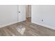 Bedroom with hardwood floors and a doorway to another room at 937 Camilla Sw St, Atlanta, GA 30314