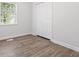 Cozy bedroom with hardwood floors and natural light, features a double closet at 937 Camilla Sw St, Atlanta, GA 30314