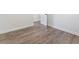 Bedroom with hardwood floors, neutral walls, and an open doorway at 937 Camilla Sw St, Atlanta, GA 30314