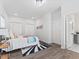 Cozy bedroom with gray-tone flooring, and a convenient open doorway to the bathroom at 937 Camilla Sw St, Atlanta, GA 30314