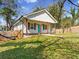 Charming cottage-style home with fenced yard and a inviting front porch at 937 Camilla Sw St, Atlanta, GA 30314