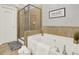 Bathroom features a separate tub and glass enclosed shower with neutral color palette at 1583 Mosaic Way, Smyrna, GA 30080