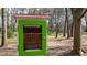 Close-up of a well-maintained community library with clear signage in a natural, wooded environment at 1583 Mosaic Way, Smyrna, GA 30080