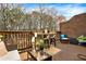 Outdoor deck area perfect for entertaining, with comfortable seating and a bar setup overlooking nature at 1583 Mosaic Way, Smyrna, GA 30080