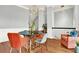Stylish dining area with bright-colored chairs, a modern table, and plenty of natural light at 1583 Mosaic Way, Smyrna, GA 30080