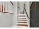 Entryway featuring hardwood stairs with white risers and grey walls leading upstairs at 1583 Mosaic Way, Smyrna, GA 30080
