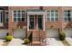 Charming brick townhome with inviting entrance, classic architectural details and attached garages at 1583 Mosaic Way, Smyrna, GA 30080