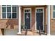 Inviting townhouse front entrance featuring brick facade, and classic details at 1583 Mosaic Way, Smyrna, GA 30080