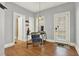 Bright home office with hardwood floors, a stylish desk, chair, and a welcoming 'Home Sweet Home' doormat at 1583 Mosaic Way, Smyrna, GA 30080