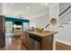 Kitchen island open to a living room featuring granite countertops and seating at 1583 Mosaic Way, Smyrna, GA 30080