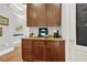 Coffee bar area featuring granite countertops, ample cabinet space, and a coffee maker at 1583 Mosaic Way, Smyrna, GA 30080