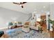 Spacious living room with hardwood floors, stylish furnishings, and plenty of natural light at 1583 Mosaic Way, Smyrna, GA 30080