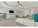 Serene main bedroom with neutral tones, ceiling fan, and large windows overlooking the backyard at 1583 Mosaic Way, Smyrna, GA 30080
