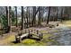 Scenic park area with exercise equipment, a picnic table, and a charming bridge surrounded by natural beauty at 1583 Mosaic Way, Smyrna, GA 30080