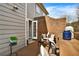 Private patio area perfect for entertaining, featuring a brick wall and comfortable seating at 1583 Mosaic Way, Smyrna, GA 30080