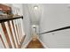 Staircase leads to wood and tile flooring with a view of the kitchen at 1583 Mosaic Way, Smyrna, GA 30080