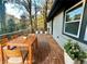 Inviting outdoor deck features wooden floors and railings, complete with a dining set and potted plants at 2371 Cresta Dr, Decatur, GA 30032