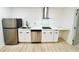 Modern kitchen featuring stainless steel appliances, white cabinetry, and countertop space, ready for cooking at 2371 Cresta Dr, Decatur, GA 30032