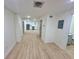 Spacious living area features light wood flooring, modern lighting, and easy access to the kitchen at 2371 Cresta Dr, Decatur, GA 30032