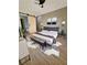 Stylish bedroom with a sliding barn door to bathroom, sleek furnishings, and modern decor at 2371 Cresta Dr, Decatur, GA 30032