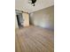 Bright main bedroom with hardwood floors and barn door leading to a bathroom at 2371 Cresta Dr, Decatur, GA 30032