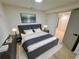 Comfortable main bedroom with modern decor, soft lighting, and an open doorway at 2371 Cresta Dr, Decatur, GA 30032