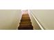 Wooden staircase with white railing, providing access to the next level of the home at 2371 Cresta Dr, Decatur, GA 30032