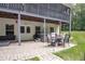 Backyard patio featuring outdoor seating, a hot tub, and lush green lawn for relaxation and entertainment at 281 Laney Dr, Locust Grove, GA 30248