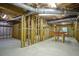 Large unfinished basement with wooden beams, concrete floor, and ample space to design at 281 Laney Dr, Locust Grove, GA 30248