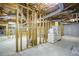 Spacious unfinished basement with exposed ceiling, concrete floor, and appliance hookups, a blank canvas ready for your design ideas at 281 Laney Dr, Locust Grove, GA 30248