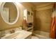 Bathroom with tile flooring, a combined shower and bathtub, storage, and decorative lighting at 281 Laney Dr, Locust Grove, GA 30248