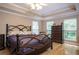 Cozy bedroom with hardwood floors, large windows, and a spacious dresser at 281 Laney Dr, Locust Grove, GA 30248