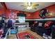 This bonus bedroom is decorated with a sports theme and includes a large couch for relaxation at 281 Laney Dr, Locust Grove, GA 30248